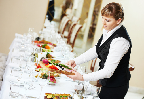 Image of a waitress offering professional Catering in Sydney